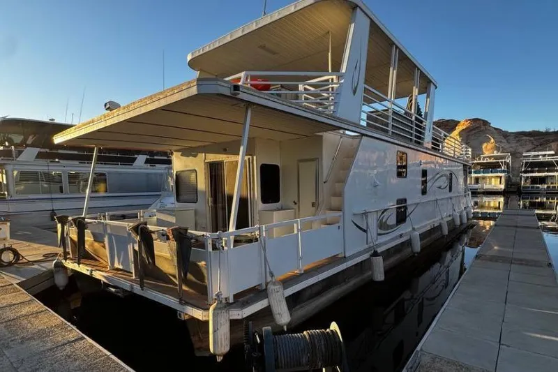 The Image of 2006 Destination Yachts houseboat docked, featuring spacious decks and modern design. - 0
