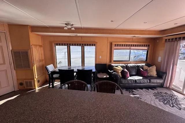 Slide: The Image of Interior of 2006 Destination Yachts model, featuring a cozy living area with large windows. - 10