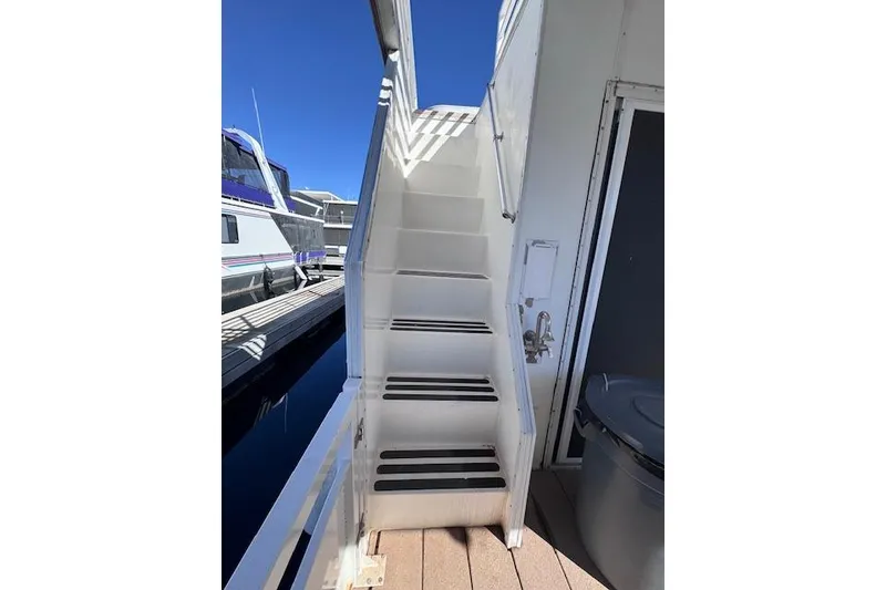Slide: The Image of Staircase on 2006 Destination Yachts Yacht Yet, docked with clear blue sky. - 16