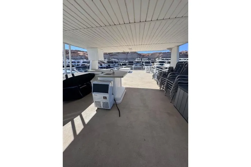 Slide: The Image of Upper deck of 2006 Destination Yachts yacht with seating and scenic views. - 19