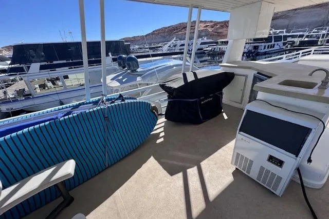 Slide: The Image of Outdoor deck of 2006 Destination Yachts, featuring surfboards and marina view. - 20