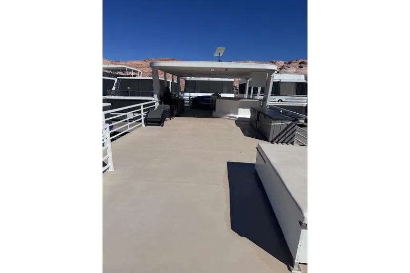 Slide: The Image of Upper deck of 2006 Destination Yachts yacht, spacious and sunlit, with seating and railing. - 22