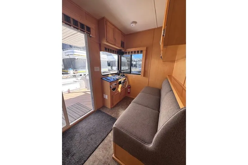 Slide: The Image of Interior of 2006 Destination Yachts model, featuring cozy seating and helm area. - 3