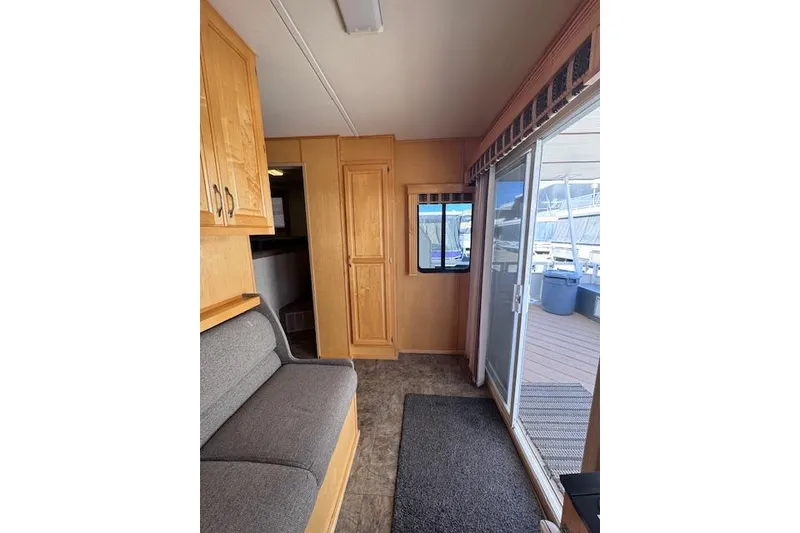 Slide: The Image of Interior of 2006 Destination Yachts Yacht with wood cabinets and sliding glass door. - 4