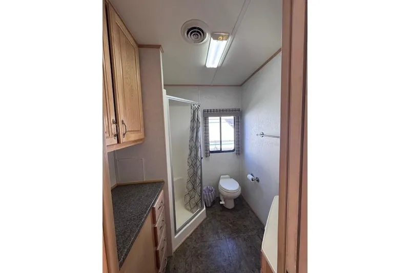 Slide: The Image of Bathroom interior of 2006 Destination Yachts Yacht Yet, featuring shower and wooden cabinetry. - 8