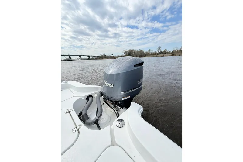 Slide: The Image of 2020 Sea Hunt BX 25 FS boat with Yamaha outboard motor on a calm river. - 11