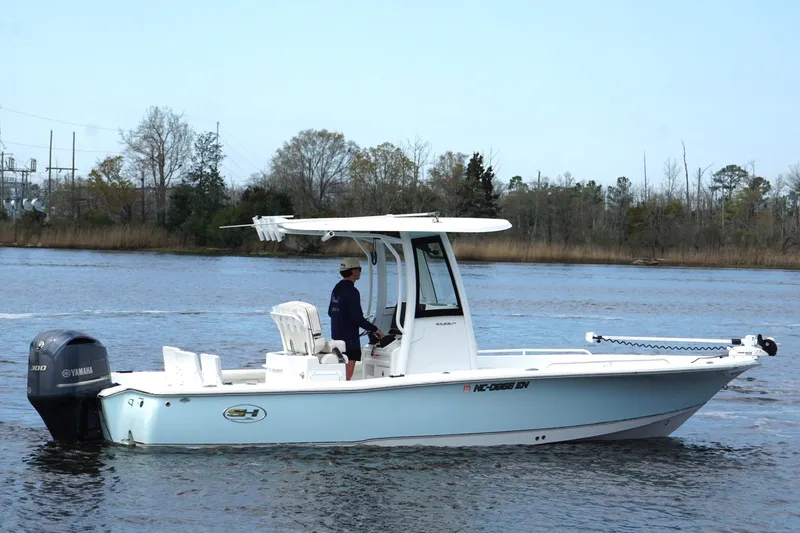 Slide: The Image of 2020 Sea Hunt BX 25 FS boat on calm water with Yamaha engine. - 3