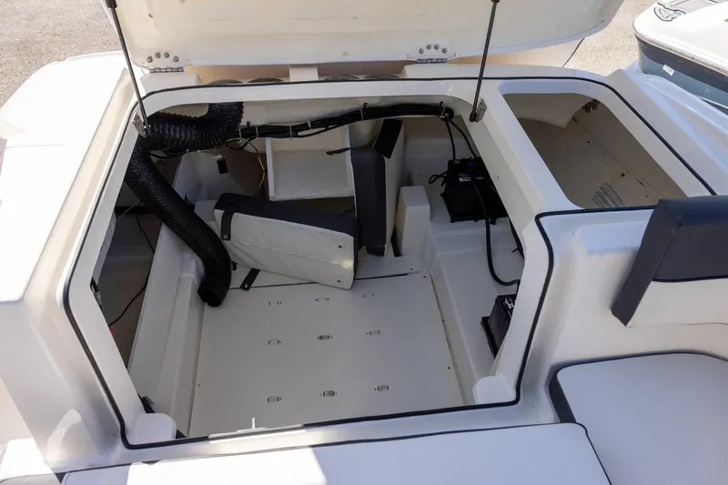 Slide: The Image of 2021 Bayliner VR6 Bowrider OB engine compartment, open hatch, interior view. - 13