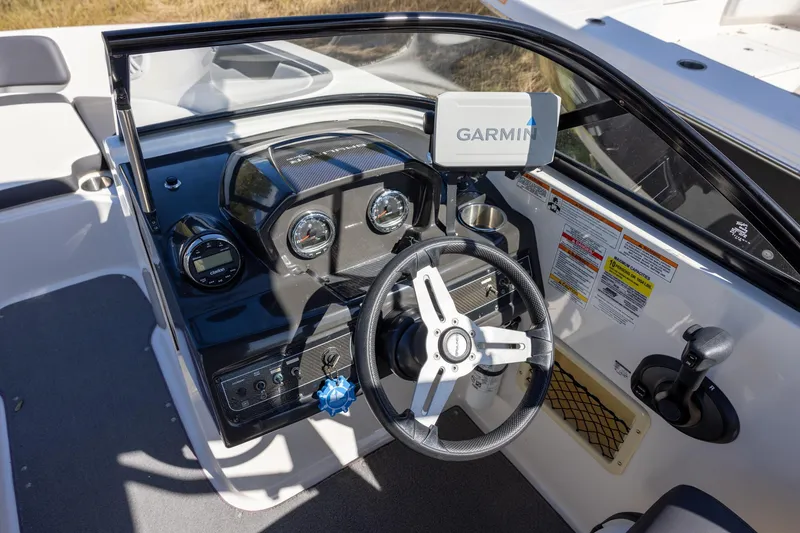 Slide: The Image of 2021 Bayliner VR6 Bowrider OB dashboard with Garmin navigation system and steering wheel. - 7