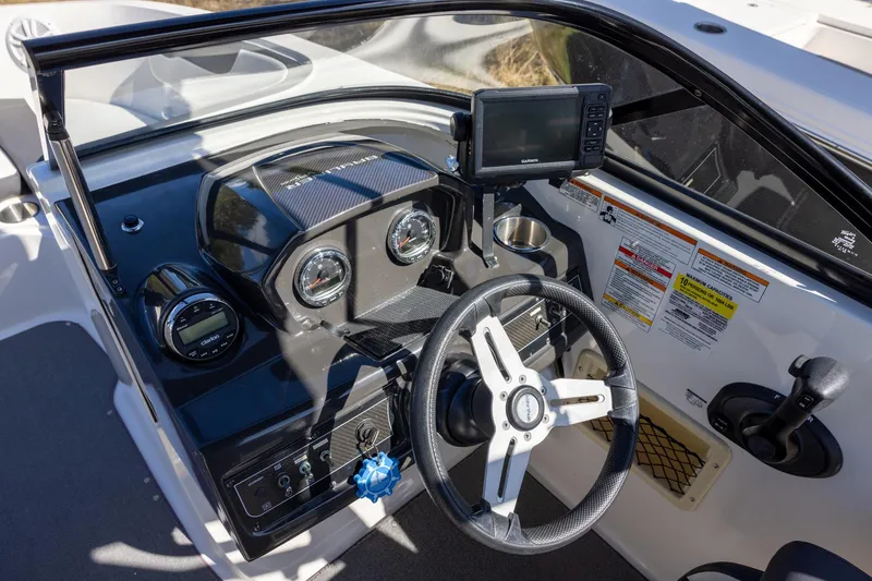 Slide: The Image of 2021 Bayliner VR6 Bowrider OB dashboard with steering wheel and navigation system. - 8