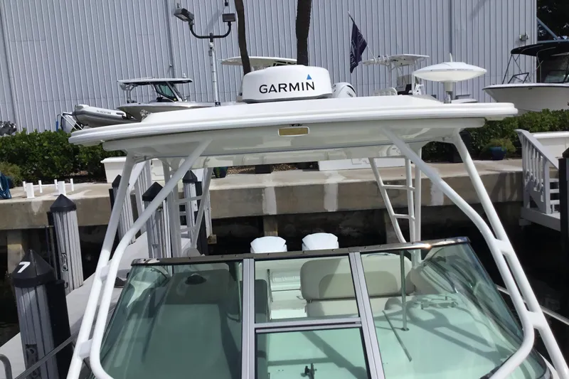Slide: The Image of 2017 Robalo R305 Walkaround boat with Garmin equipment at dockside. - 11