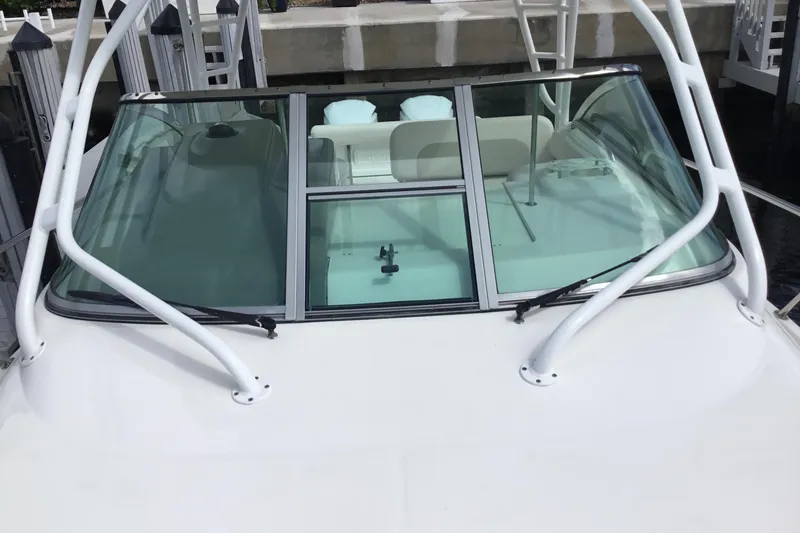 Slide: The Image of 2017 Robalo R305 Walkaround boat windshield and cockpit view. - 12