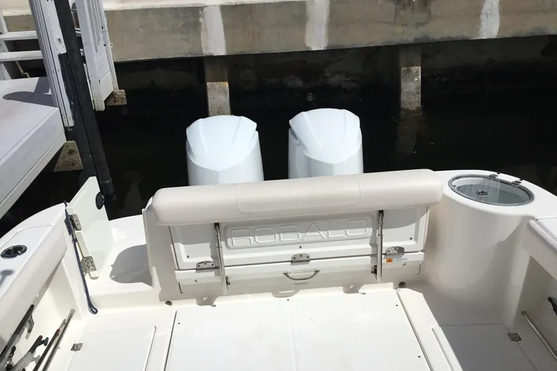 Slide: The Image of 2017 Robalo R305 Walkaround boat with dual engines at dock. - 20