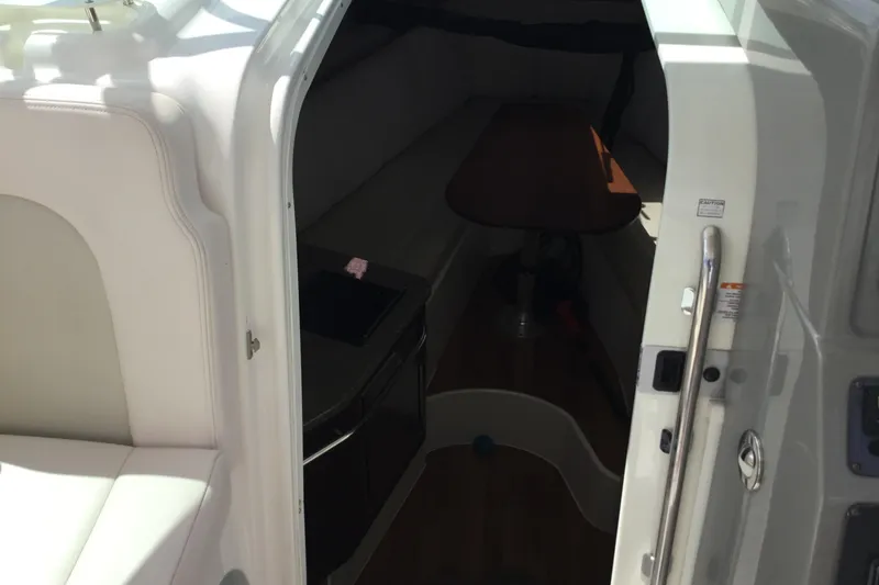Slide: The Image of 2017 Robalo R305 Walkaround cabin interior with seating and table. - 32