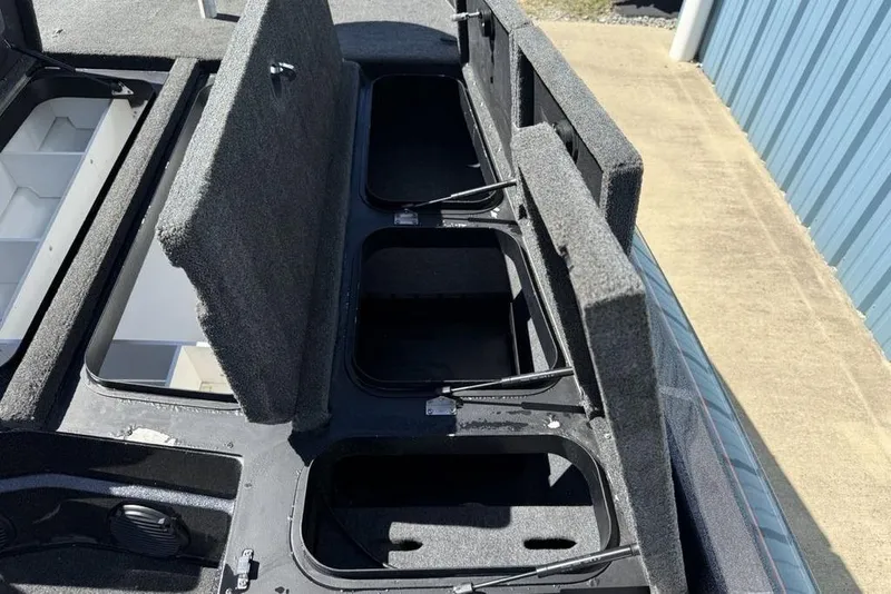 Slide: The Image of 2019 Skeeter ZX250 boat storage compartments with open lids, showcasing interior space. - 12