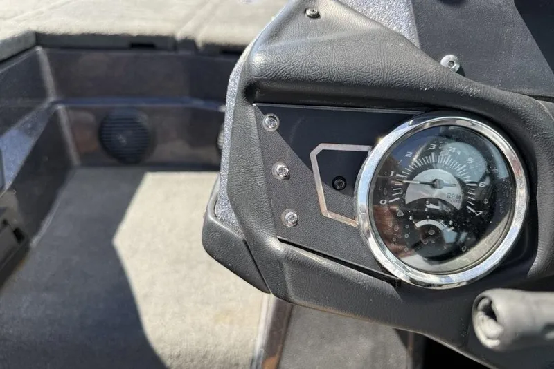 Slide: The Image of 2019 Skeeter ZX250 boat dashboard with RPM gauge and speaker. - 14