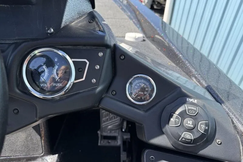 Slide: The Image of Dashboard of a 2019 Skeeter ZX250 boat with gauges and controls. - 15
