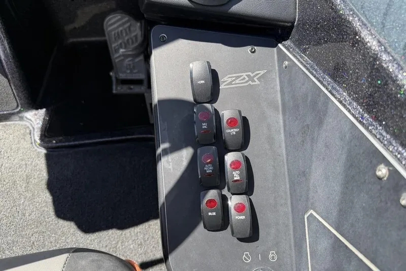 Slide: The Image of Control panel of a 2019 Skeeter ZX250 boat with labeled switches. - 16