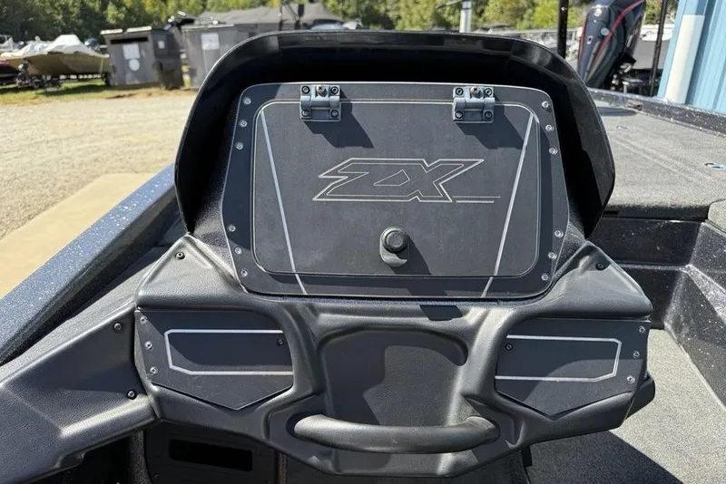 Slide: The Image of 2019 Skeeter ZX250 boat dashboard with storage compartment, outdoors. - 18