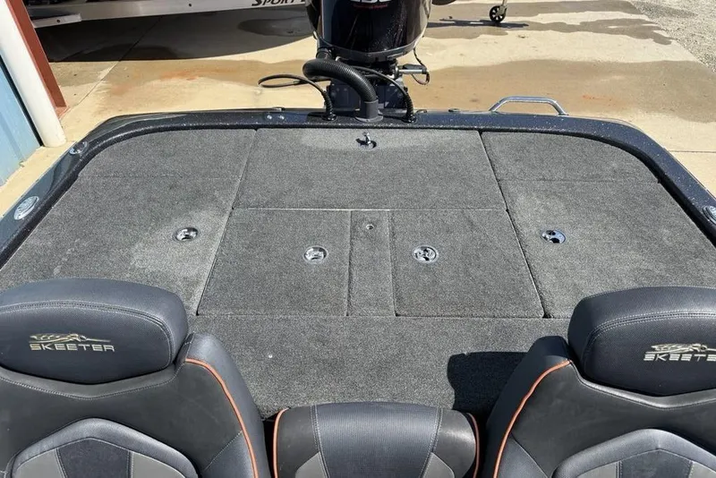 Slide: The Image of 2019 Skeeter ZX250 boat deck with storage compartments and branded seats. - 19