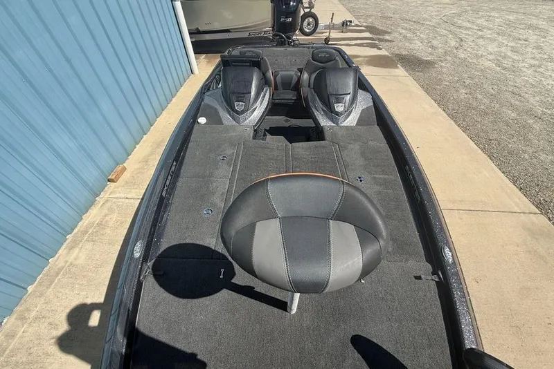 Slide: The Image of 2019 Skeeter ZX250 boat interior with seating and carpeted deck. - 25