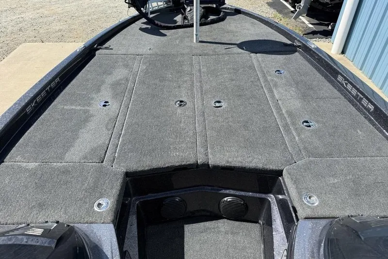 Slide: The Image of 2019 Skeeter ZX250 boat deck with carpeted surface and storage compartments. - 8
