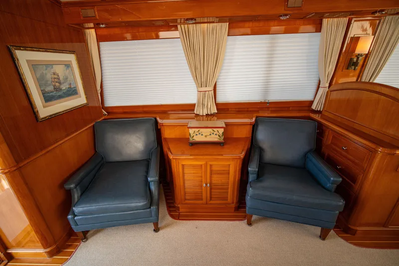 Slide: The Image of Luxurious 2004 Grand Banks 58 Eastbay FB yacht interior with elegant seating and wood paneling. - 20