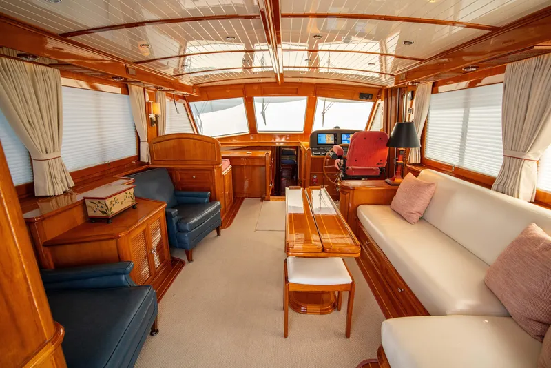 Slide: The Image of Luxurious interior of 2004 Grand Banks 58 Eastbay FB yacht, featuring elegant wood finishes. - 14