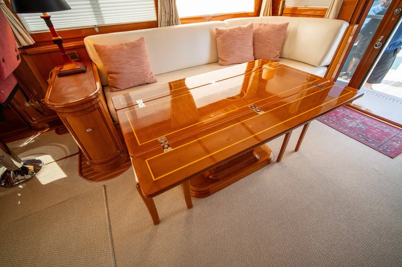 Slide: The Image of Luxurious interior of 2004 Grand Banks 58 Eastbay FB yacht with elegant wood table. - 18