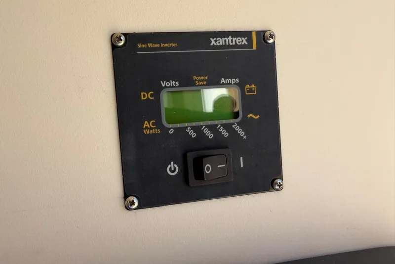 Slide: The Image of Xantrex sine wave inverter on 2021 Scout 330 LXF boat dashboard. - 22
