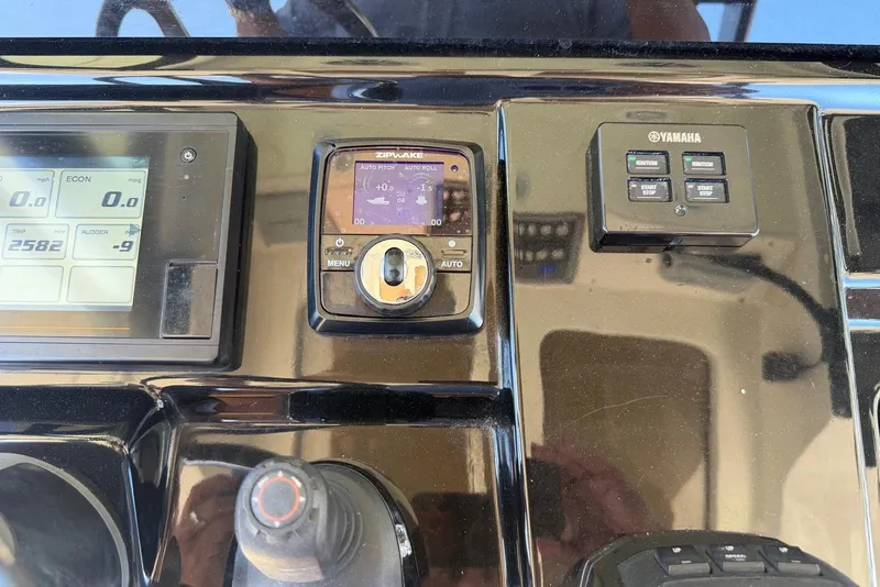 Slide: The Image of Control panel of a 2021 Scout 330 LXF boat with Yamaha and Zipwake systems. - 6