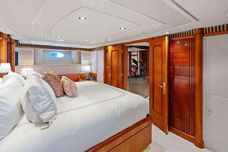 Slide: The Image of Luxurious bedroom interior of 2001 West Bay Sonship yacht with elegant wood finishes. - 11