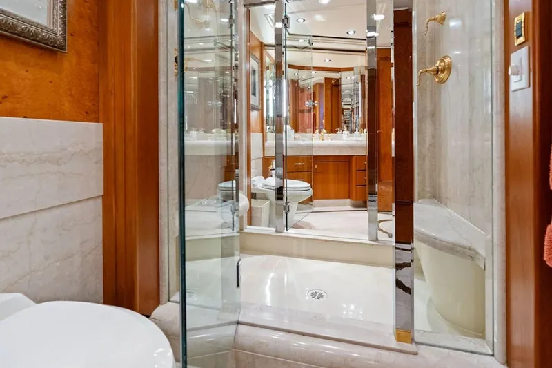 Slide: The Image of Luxurious bathroom in 2001 West Bay Sonship yacht with glass shower and elegant fixtures. - 14