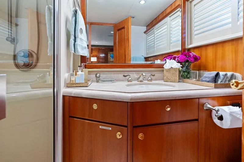 Slide: The Image of Luxurious 2001 West Bay Sonship yacht bathroom with wood cabinetry and elegant decor. - 20