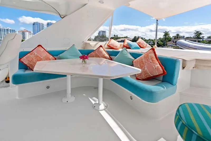 Slide: The Image of Luxurious 2001 West Bay Sonship yacht interior with vibrant cushions and elegant seating area. - 24