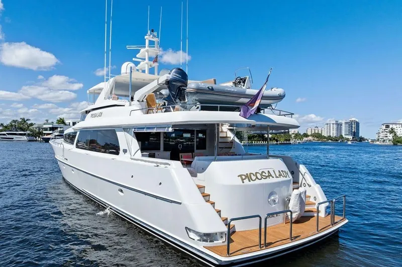 Slide: The Image of Luxury 2001 West Bay Sonship yacht on water, clear sky, modern design. - 30