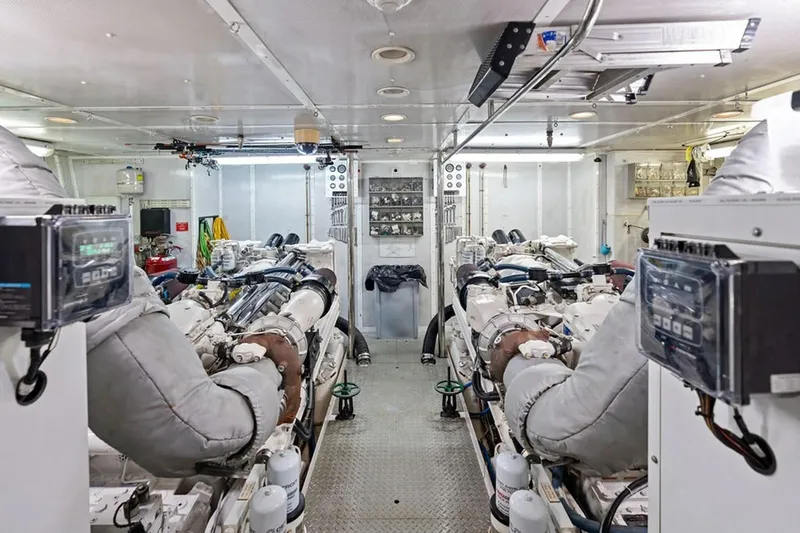 Slide: The Image of Engine room of 2001 West Bay Sonship yacht, featuring dual engines and control panels. - 31