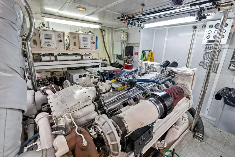 Slide: The Image of Engine room of 2001 West Bay Sonship yacht, showcasing machinery and equipment. - 32