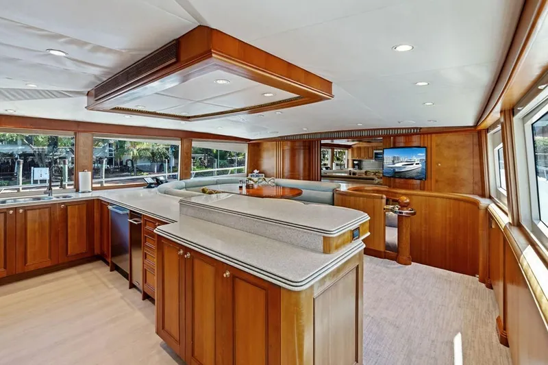 Slide: The Image of Luxurious 2001 West Bay Sonship yacht interior with elegant wood cabinetry and spacious layout. - 5
