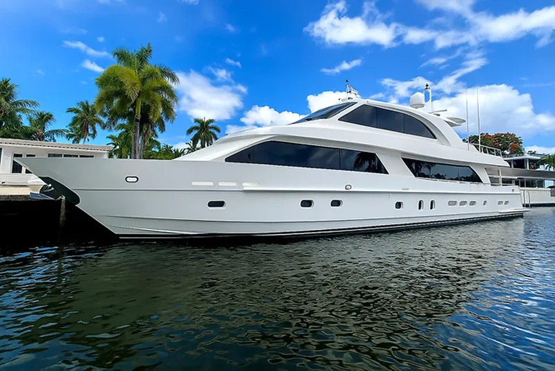 The Image of 2014 Hargrave Sky Lounge yacht docked, surrounded by palm trees and blue sky. - 0