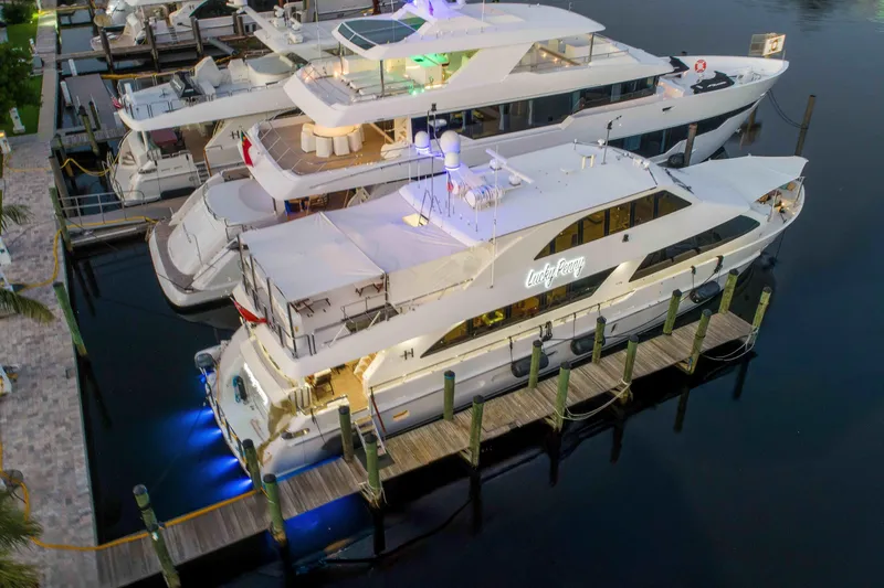 Slide: The Image of Luxurious 2014 Hargrave Sky Lounge yacht docked at marina, illuminated at night. - 1