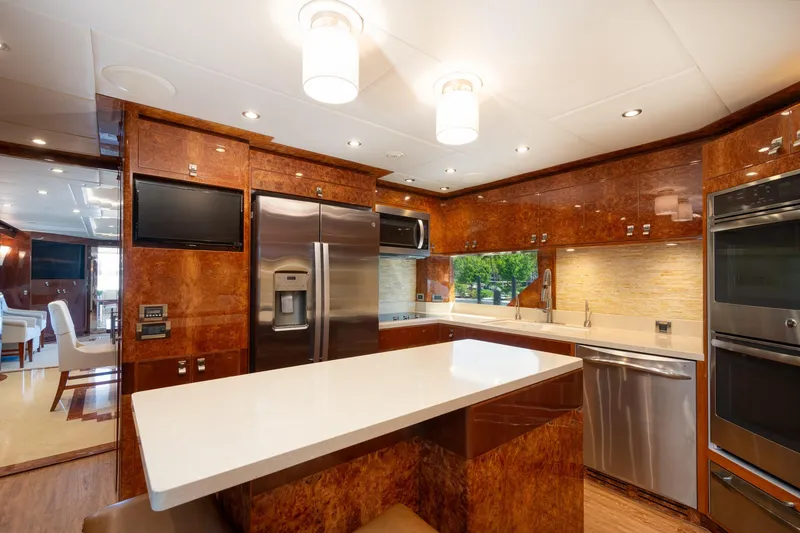 Slide: The Image of Luxurious kitchen in 2014 Hargrave Sky Lounge yacht with modern appliances and elegant wood finishes. - 19