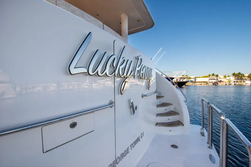 Slide: The Image of Luxury yacht "Lucky Penny" docked, Hargrave Sky Lounge 2014 model, sunny marina view. - 2