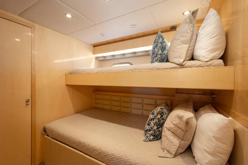 Slide: The Image of 2014 Hargrave Sky Lounge yacht cabin with bunk beds and plush pillows. - 35