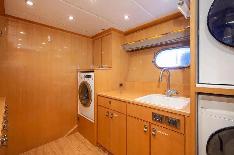 Slide: The Image of Laundry room in 2014 Hargrave Sky Lounge yacht with washer, dryer, and sink. - 36