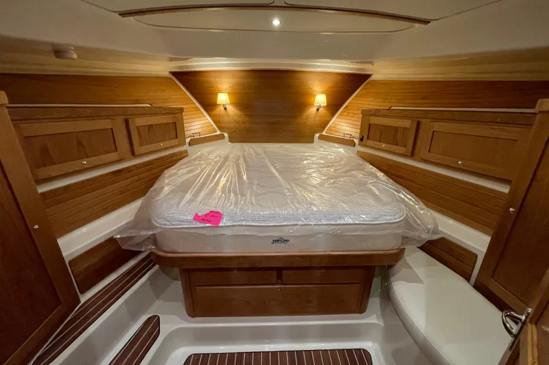 Slide: The Image of Luxurious cabin interior of 2026 Back Cove 372 yacht with wooden accents and cozy lighting. - 14