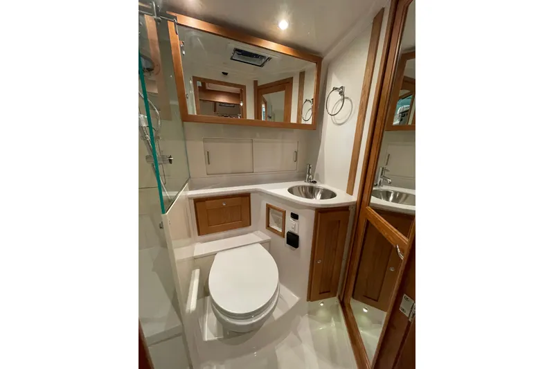 Slide: The Image of Luxurious bathroom in 2026 Back Cove 372 yacht with modern fixtures and wood accents. - 16