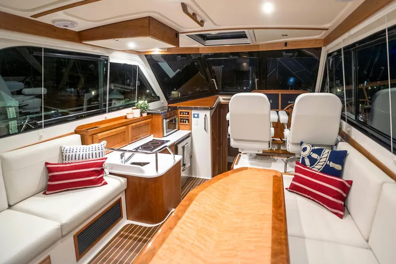 Slide: The Image of Luxurious interior of 2026 Back Cove 372 yacht with elegant seating and modern helm. - 23