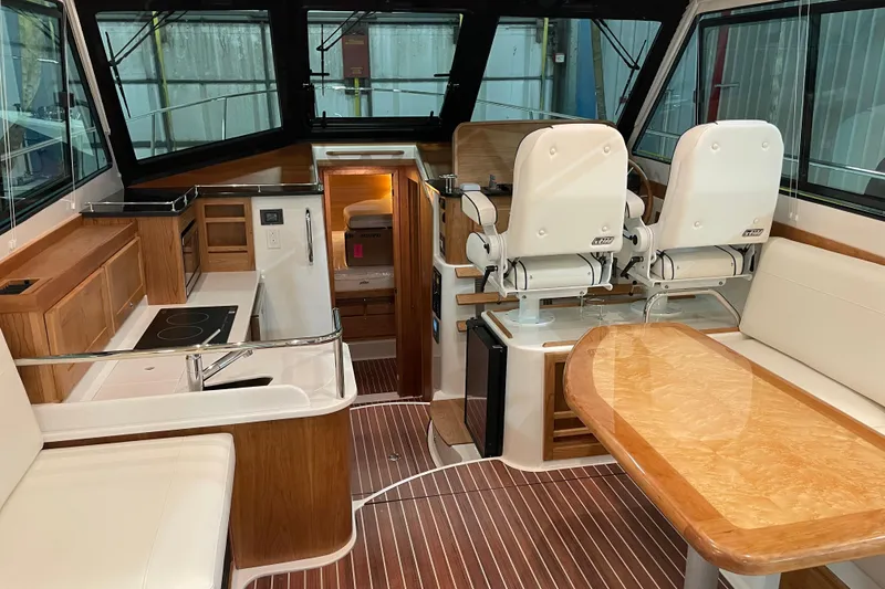 Slide: The Image of Interior of 2026 Back Cove 372 yacht with modern kitchen and seating area. - 3