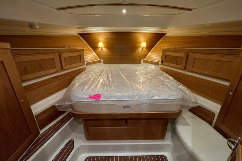 Slide: The Image of Luxurious cabin interior of 2026 Back Cove 372 yacht with wooden accents and cozy lighting. - 5